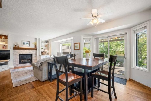 268 Douglas Woods Drive Se, Calgary, AB - Indoor Photo Showing Dining Room With Fireplace