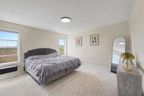 53 Fireside Crescent, Cochrane, AB - Indoor Photo Showing Bedroom