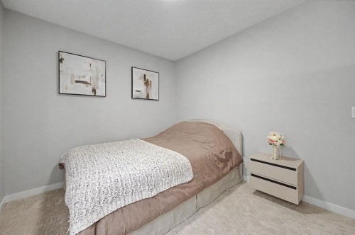 53 Fireside Crescent, Cochrane, AB - Indoor Photo Showing Bedroom