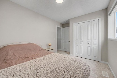 53 Fireside Crescent, Cochrane, AB - Indoor Photo Showing Bedroom