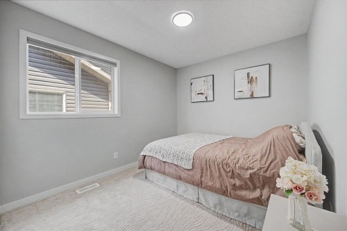 53 Fireside Crescent, Cochrane, AB - Indoor Photo Showing Bedroom