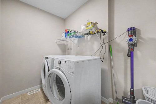 53 Fireside Crescent, Cochrane, AB - Indoor Photo Showing Laundry Room