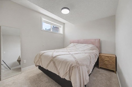 53 Fireside Crescent, Cochrane, AB - Indoor Photo Showing Bedroom