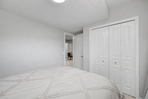 53 Fireside Crescent, Cochrane, AB - Indoor Photo Showing Bedroom