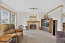 5611 Sunrise Crescent, Olds, AB  - Indoor Photo Showing Living Room With Fireplace 