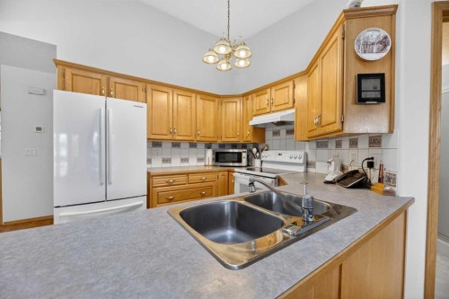5611 Sunrise Crescent, Olds, AB - Indoor Photo Showing Kitchen With Double Sink