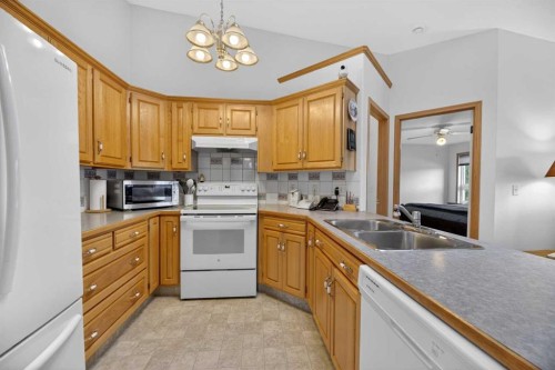 5611 Sunrise Crescent, Olds, AB - Indoor Photo Showing Kitchen With Double Sink