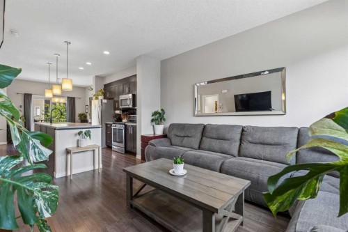 213 Copperpond Villas Se, Calgary, AB - Indoor Photo Showing Living Room