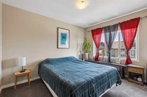 213 Copperpond Villas Se, Calgary, AB - Indoor Photo Showing Bedroom