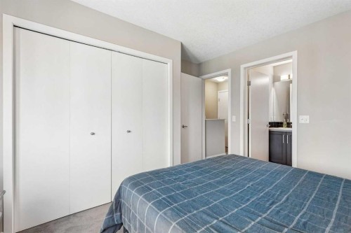 213 Copperpond Villas Se, Calgary, AB - Indoor Photo Showing Bedroom