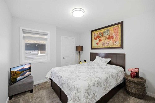 1153 Chinook Gate Bay Sw, Airdrie, AB - Indoor Photo Showing Bedroom