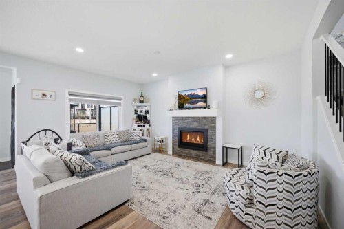 1153 Chinook Gate Bay Sw, Airdrie, AB - Indoor Photo Showing Living Room With Fireplace