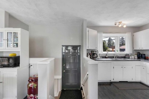249 Acadia Drive Se, Calgary, AB - Indoor Photo Showing Kitchen With Double Sink