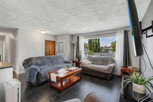 249 Acadia Drive Se, Calgary, AB - Indoor Photo Showing Living Room