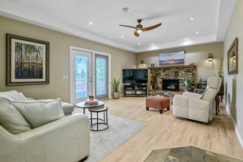 39 Canova Close Sw, Calgary, AB - Indoor Photo Showing Living Room With Fireplace