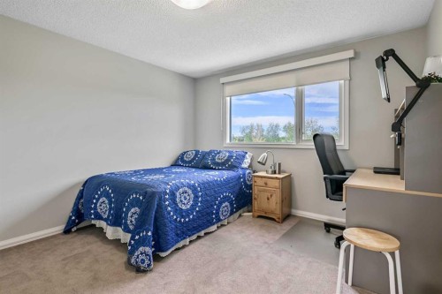 39 Canova Close Sw, Calgary, AB - Indoor Photo Showing Bedroom