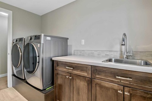 39 Canova Close Sw, Calgary, AB - Indoor Photo Showing Laundry Room