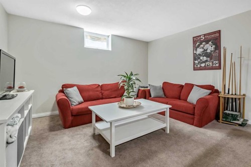 39 Canova Close Sw, Calgary, AB - Indoor Photo Showing Living Room