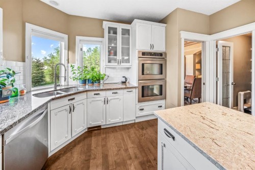 40 Blueridge Bay, Rural Rocky View County, AB - Indoor Photo Showing Kitchen With Double Sink