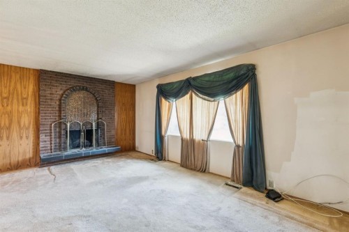 1132 Hunterston Hill Nw, Calgary, AB - Indoor With Fireplace