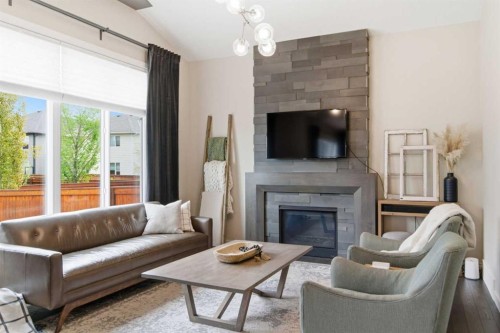134 Cranbrook Circle Se, Calgary, AB - Indoor Photo Showing Living Room With Fireplace