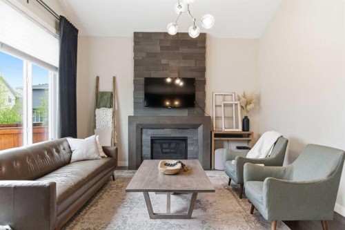 134 Cranbrook Circle Se, Calgary, AB - Indoor Photo Showing Living Room With Fireplace