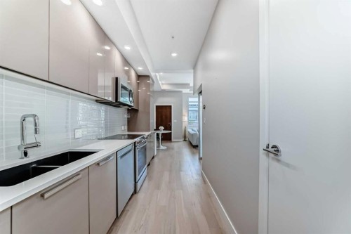 2105-1234 5 Avenue Nw, Calgary, AB - Indoor Photo Showing Kitchen With Double Sink With Upgraded Kitchen