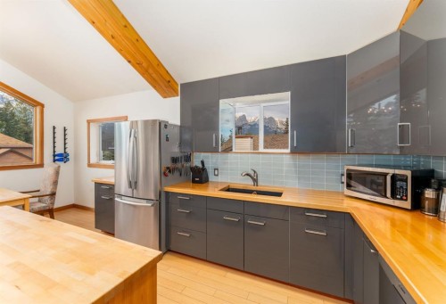 132 Settler Way, Canmore, AB - Indoor Photo Showing Kitchen With Double Sink