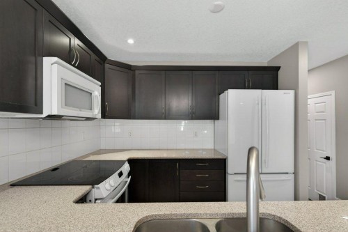 1012 Windsong Drive Sw, Airdrie, AB - Indoor Photo Showing Kitchen