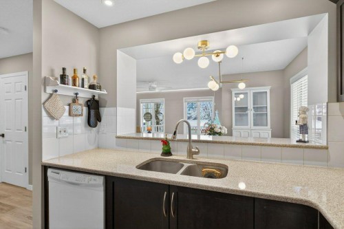 1012 Windsong Drive Sw, Airdrie, AB - Indoor Photo Showing Kitchen With Double Sink
