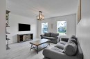209 Copperpond Parade Se, Calgary, AB  - Indoor Photo Showing Living Room 