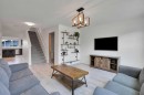 209 Copperpond Parade Se, Calgary, AB  - Indoor Photo Showing Living Room 
