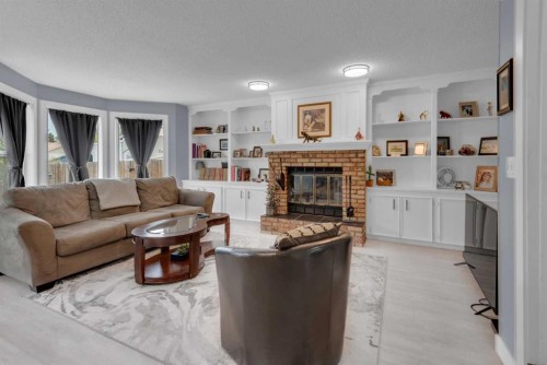67 Deersaxon Circle Se, Calgary, AB - Indoor Photo Showing Living Room With Fireplace