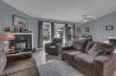 67 Deersaxon Circle Se, Calgary, AB  - Indoor Photo Showing Living Room With Fireplace 