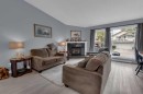 67 Deersaxon Circle Se, Calgary, AB  - Indoor Photo Showing Living Room With Fireplace 