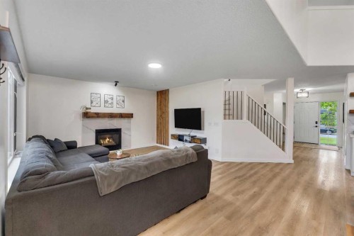 46 Wilson Road Ne, Langdon, AB - Indoor With Fireplace