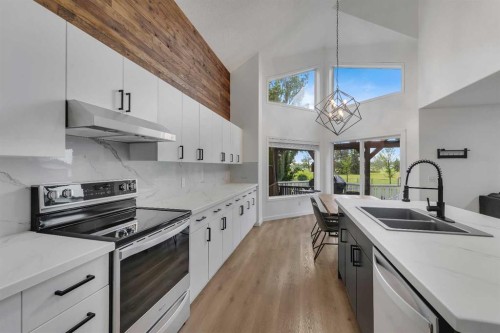46 Wilson Road Ne, Langdon, AB - Indoor Photo Showing Kitchen With Stainless Steel Kitchen With Double Sink With Upgraded Kitchen
