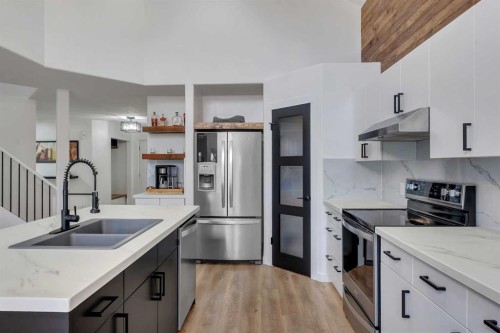 46 Wilson Road Ne, Langdon, AB - Indoor Photo Showing Kitchen With Stainless Steel Kitchen With Double Sink With Upgraded Kitchen