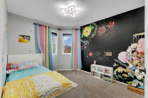 46 Wilson Road Ne, Langdon, AB - Indoor Photo Showing Bedroom
