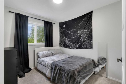 46 Wilson Road Ne, Langdon, AB - Indoor Photo Showing Bedroom