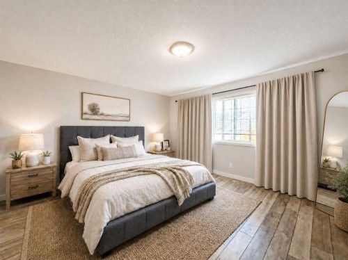 129 Cimarron Grove Circle, Okotoks, AB - Indoor Photo Showing Bedroom