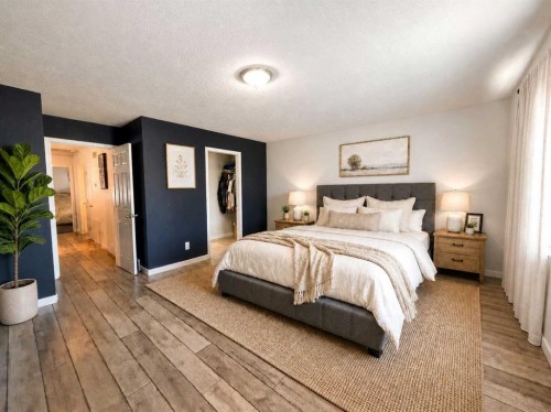 129 Cimarron Grove Circle, Okotoks, AB - Indoor Photo Showing Bedroom