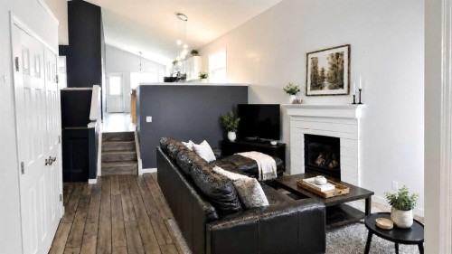 129 Cimarron Grove Circle, Okotoks, AB - Indoor With Fireplace