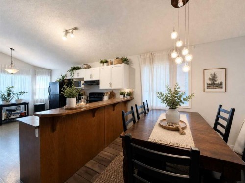 129 Cimarron Grove Circle, Okotoks, AB - Indoor Photo Showing Dining Room