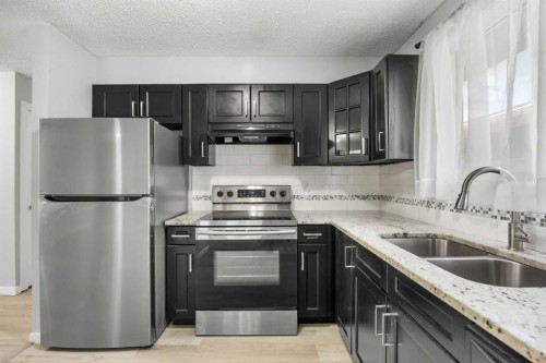35 Bermuda Drive Nw, Calgary, AB - Indoor Photo Showing Kitchen With Stainless Steel Kitchen With Double Sink With Upgraded Kitchen