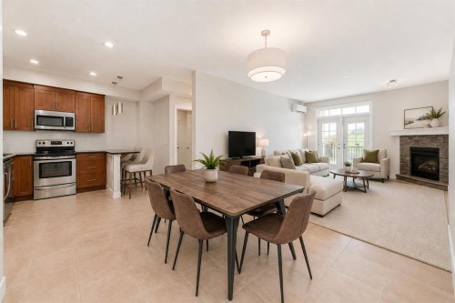 210-1005A Westmount Drive, Strathmore, AB - Indoor With Fireplace