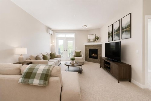 210-1005A Westmount Drive, Strathmore, AB - Indoor Photo Showing Living Room With Fireplace