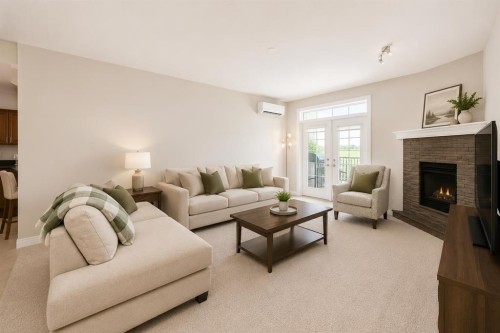 210-1005A Westmount Drive, Strathmore, AB - Indoor Photo Showing Living Room With Fireplace