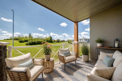 210-1005A Westmount Drive, Strathmore, AB - Outdoor With Deck Patio Veranda With Exterior