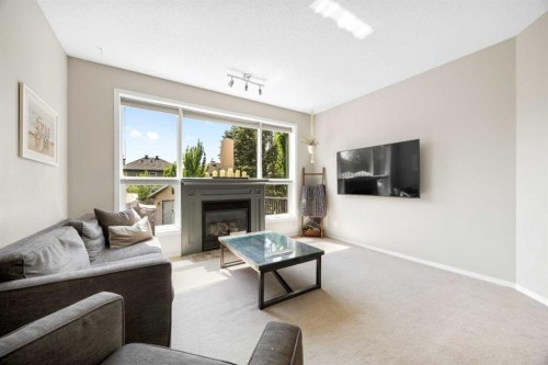 138 Cranwell Close Se, Calgary, AB - Indoor Photo Showing Living Room With Fireplace